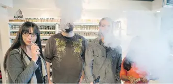  ?? LIAM RICHARDS/THE STARPHOENI­X ?? Left to right, Sheri Wollf, Ian McWalter, Jim Wollf and Diana Posso vape in their store Heavy Jam Vape on Sunday. A proposed city bylaw may prevent them from demonstrat­ing their product.