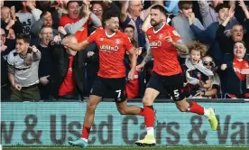  ?? Photograph: Michael Zemanek/Shuttersto­ck ?? Luton captain Sonny Bradley (right) and his teammate Harry Cornick run off to celebrate after Bradley’s equaliser against Huddersfie­ld.