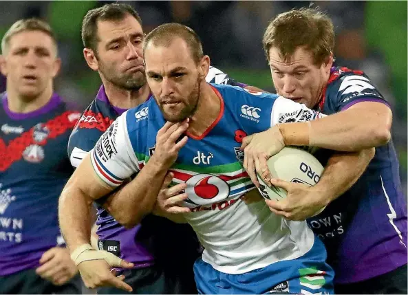  ??  ?? Warriors veteran Simon Mannering on the charge against the Melbourne Storm.