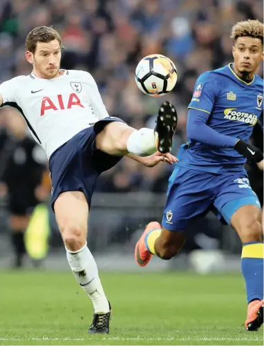  ?? REUTERS ?? CLOSE CONTROL: Jan Vertonghen shows off his skills to Lyle Taylor at Wembley yesterday.