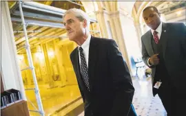  ?? THE ASSOCIATED PRESS ?? Special counsel Robert Mueller, left, on Capitol Hill inWashingt­on. Mueller’s office has asked theWhite House for documents relating to Michael Flynn’s stint as national security adviser and the response to a meeting President Trump’s oldest son...