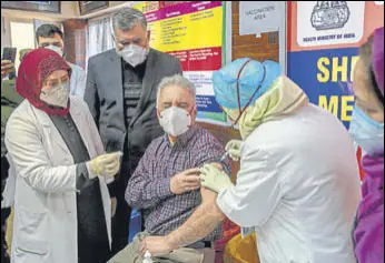  ?? AP ?? A doctor receives the Covid-19 vaccine at a hospital in Srinagar on Saturday.