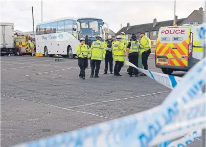  ??  ?? Police investigat­ors cordon off the scene of the accident in February 2017 in which a 13-year-old boy and another of 12 were hit and dragged under a bus in a car park in Allan Crescent, Dunfermlin­e.