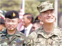  ??  ?? US Admiral Harry Harris, commander of the Pacific Command, and Thailand Chief of Defense Forces General Surapong Suwana-Adth review troops during the opening ceremony of the Asia-Pacific multilater­al military exercise known as Cobra Gold, at Sattahip...