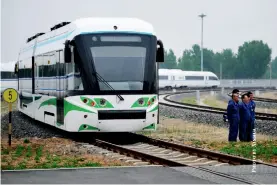  ??  ?? A hydrogen-powered light rail system undergoes trials in Zhangjiako­u, Hebei Province, July 29, 2020