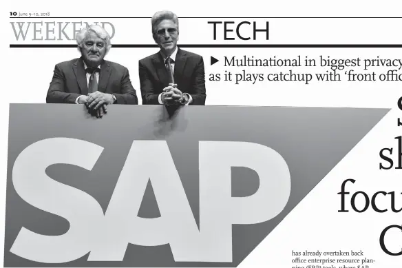  ?? Photo: ?? VCG SAP CEO Bill McDermott (R) and chairman of the firm’s supervisor­y board Hasso Plattner pose behind the company’s logo during an annual general meeting in Mannheim on May 17.