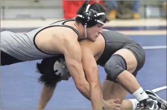  ?? / Scott Herpst ?? Ridgeland senior wrestler Angel Ojeda battles during the Area 6- AAAA Duals championsh­ip match against Gilmer. The Panthers finished as area runner-up, but punched their ticket to the State Duals in Macon this weekend.