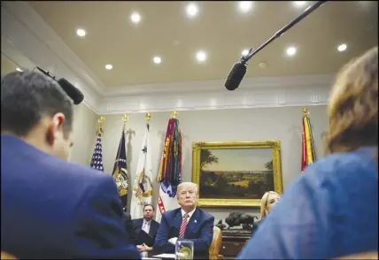  ?? AP PHOTO ?? President Donald Trump listens during a meeting with state and local officials to discuss school safety in the Roosevelt Room of the White House.