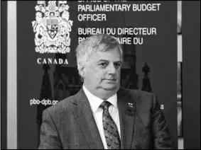  ?? CP PHOTO ?? Parliament­ary Budget Officer Jean-denis Frechette is seen before speaking with the media, in Ottawa. A new analysis says roughly 900 Canadian families earning less than $100,000 per year will have to pay more taxes because of federal changes to tighten...