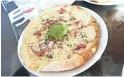  ?? DOMINIC ARMATO/THE REPUBLIC ?? Mortadella quesadilla with avocado, asadero cheese, red onion and cilantro at Roland’s Cafe Market Bar.