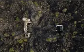  ?? (AP/Eduardo Verdugo) ?? A church tower on Feb. 21 peeks above from where lava from the Paricutin volcano buried the church decades ago.