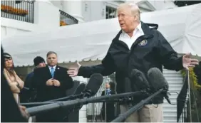  ?? AP PHOTO/JACQUELYN MARTIN ?? President Donald Trump answers questions from members of the media as he leaves the White House on Saturday en route to see fire damage in California.