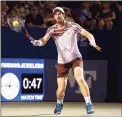  ?? Grant Halverson / Getty Images ?? Andy Murray returns a shot to Frances Tiafoe during the Winston-Salem Open at Wake Forest Tennis Complex on Tuesday in Winston Salem, N.C.