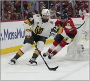  ?? LYNNE SLADKY — THE ASSOCIATED PRESS ?? Golden Knights defenseman Nicolas Hague, left, skates with the puck as the Panthers’ Carter Verhaeghe pursues.