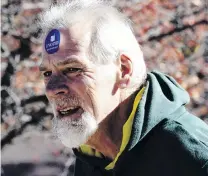  ?? PHOTO: REUTERS ?? Done . . . A man wears an ‘‘I Voted’’ sticker on his forehead as he leaves a polling site yesterday at Lane Intermedia­te School in West Allis, Milwaukee County, Wisconsin.