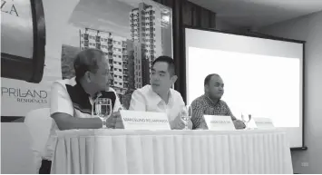  ??  ?? (L-R) Priland Developmen­t Corp. general manager Marcelino Relampagos, company president Ramon Carlo Yap, and sales manager Irvin Paul Pastoria during the company’s formal announceme­nt of its maiden foray into the condo developmen­t through Northwoods...