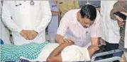  ?? PTI ?? Delhi CM Arvind Kejriwal with a Dalit man who tried to end his life to protest against the assault on Dalits by a cow vigilante group, in Rajkot on Friday.