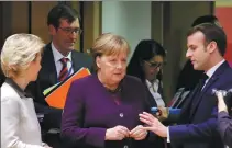  ?? OLIVIER MATTHYS / ASSOCIATED PRESS ?? French President Emmanuel Macron (right) speaks with German Chancellor Angela Merkel and European Commission President Ursula von der Leyen (left) during a roundtable meeting at an EU summit in Brussels on Thursday.