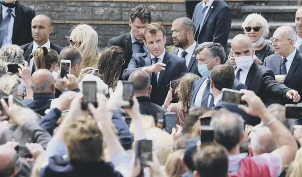  ?? PICTURE: LUDOVIC MARIN/AFP VIA GETTY IMAGES ?? 0 French president Emmanuel Macron leaves the city hall in Le Touquet, western France after voting in the mayoral elections