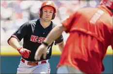  ?? Rebecca S. Gratz / Associated Press ?? N.C. State's Jonny Butler rounds the bases after hitting a two-run homer in the first. He had a career-high five RBIS.