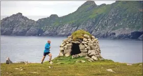  ??  ?? Marathon man Bill Cameron makes his way round St Kilda.