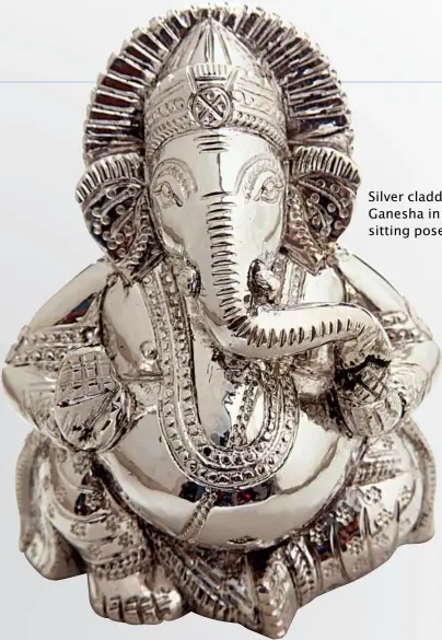  ??  ?? Silver cladded Ganesha in a sitting pose