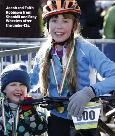  ??  ?? Jacob and Faith Robinson from Shankill and Bray Wheelers after the under-12s.