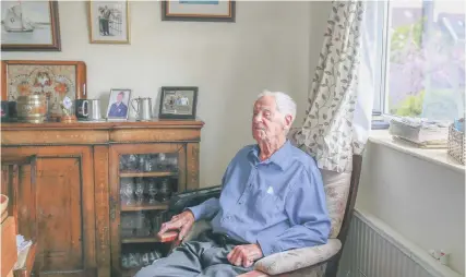  ?? Pic: James Beck ?? Ray Buck at his home in Pill and, below, as a young man