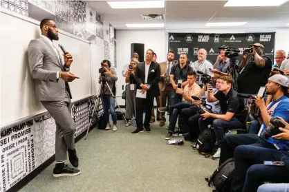  ??  ?? LeBron James addresses the media at the 2018 opening of the I Promise School, a district-run public school in his Ohio hometown of Akron that was the brainchild of James’s foundation and the city’s public school district. Photograph: Jason Miller/Getty Images