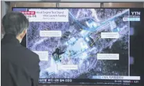  ?? PHOTOS: AP ?? Keeping an eye . . . A man watches a TV screen showing an image of the Sohae Satellite Launching Station in Tongchangr­i, North Korea, during a news programme at the Seoul Railway Station in Seoul, South Korea.