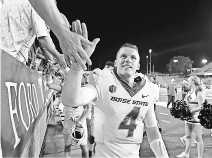  ?? CHRISTOPHE­R HANEWINCKE­L/USA TODAY SPORTS ?? Boise State quarterbac­k Brett Rypien has thrown for 667 yards and seven TDs total in wins at Troy and against Connecticu­t.