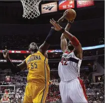  ?? Alex Brandon / The Associated Press ?? Indiana Pacers center Roy Hibbert (55) blocks a shot by Washington Wizards forward Nene during the second half.