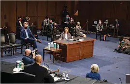  ?? DEMETRIUS FREEMAN / THE WASHINGTON POST VIA AP ?? Barrett speaks during a confirmati­on hearing before the Senate Judiciary Committee.