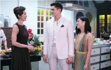  ??  ?? Michelle Yeoh, left, Henry Golding and Constance Wu star in Crazy Rich Asians — a movie with a cast which was assembled in a sweeping worldwide search that included multiple countries.