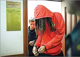  ?? ALEXANDER ZEMLIANICH­ENKO / AP ?? WNBA star and two-time Olympic gold medalist Brittney Griner leaves a courtroom after a hearing in Khimki just outside Moscow, Russia on May 13.