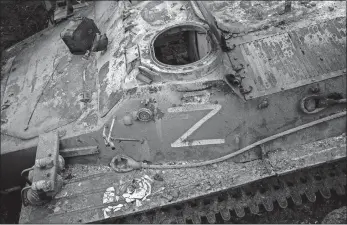  ?? BERNAT ARMANGUE/AP PHOTO ?? The letter Z, which has become the Russian emblem for the war, is seen Friday on a destroyed Russian armored personnel carrier near Kutuzivka in east Ukraine.