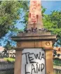  ?? FACEBOOK PHOTO ?? The obelisk on the Plaza, which was spraypaint­ed with the word ‘racist’ on top and ‘Tewa land’ at the base.