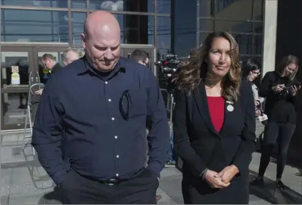  ?? ANDREW VAUGHAN, THE CANADIAN PRESS ?? RCMP Cpl. Pat Bouchard, left, and Angela Gevaudan, wife of slain RCMP Const. Fabrice Gevaudan in Moncton Friday. The RCMP has been convicted of violating the Labour Code for failing to provide members with use-of-force equipment in connection with the...