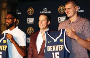 ?? AP/DAVID ZALUBOWSKI ?? Denver Nuggets center Nikola Jokic (right) joins guard Will Barton (left) and Josh Kroenke, president of the Denver Nuggets, during a news conference Monday to outline a contract extension for Jokic and the re-signing of Barton.