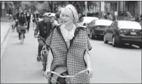  ?? DAX MELMER/The Windsor Star ?? About 20 people were expected for the first Tweed Run, but more than 50 turned up on Sunday, dressed in retro costume.
They road through the city, stopping at pubs along the way.