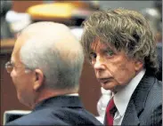  ?? GETTY IMAGES FILE ?? Phil Spector is seen with his attorney Roger Rosen during his murder trial at the Los Angeles Superior Court in Los Angeles on Sept. 18, 2007. Spector, who revolution­ized 1960s pop music but ended up in prison for murder, died Saturday, authoritie­s said on Sunday.