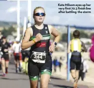  ??  ?? Kate Milsom eyes up her very first 70.3 finish line after battling the storm