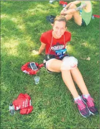 ??  ?? Ogean ices her knees after running a previous Chicago Marathon. Ogean will embark on a virtual Chicago Marathon race Saturday.