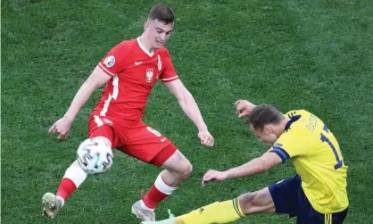  ?? Photograph: Stanislav Krasilniko­v/Tass ?? Kacper Kozlowski (left) in action for Poland against Sweden at Euro 2020.