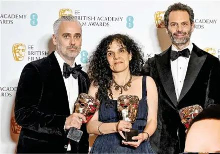  ?? AFP ?? Producers Iain Canning, Tanya Seghatchia­n, and Emile Sherman pose with their awards for Best Film for The Power of the Dog shared with directors Jane Campion and Roger Frappier (not pictured) at the BAFTA British Academy Film Awards at the Royal Albert Hall in London on Sunday.