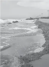  ?? N.C. DEPARTMENT OF TRANSPORTA­TION ?? Storms and high tides damaged the dunes and parts of N.C. 12 in Ocracoke last month.