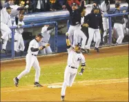  ?? Bill Kostroun / Associated Press ?? In this Oct. 31, 2001, file photo, the Yankees' Derek Jeter celebrates his game-winning home run in the 10th inning of Game 4 of of the World Series against the Arizona Diamondbac­ks at Yankee Stadium in New York. Jeter was elected to the Baseball Hall of Fame on Tuesday.