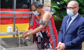  ??  ?? Acting prime minister Themba Masuku performs a ceremonial handwash to mark the completion of the Lobamba clinic. Photograph: Courtesy of Frazer Solar