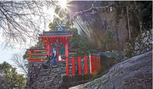  ??  ?? BoTTom Pilgrims at Kamikura-jinja and Gotobiki-Iwa rock. The fact that the rock is venerated as a deity highlights the tradition of nature worship in this area. opposiTe paGe Pilgrims in Heian period costumes at Nachisan Seiganto-ji Temple near Nachi Taisha shrine.