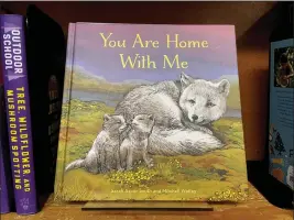  ?? CLAIRE RUSH — THE ASSOCIATED PRESS ?? The children’s book “You Are Home With Me,” illustrate­d by Mitchell Thomas Watley, is shown at a bookstore in Portland, Ore.